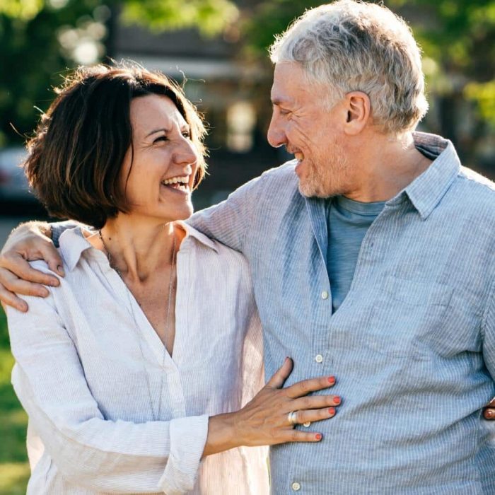 Happy senior couple smiling outdoors – Direct Wealth’s financial advisors in Ipswich, Queensland, provide expert retirement and wealth planning advice.