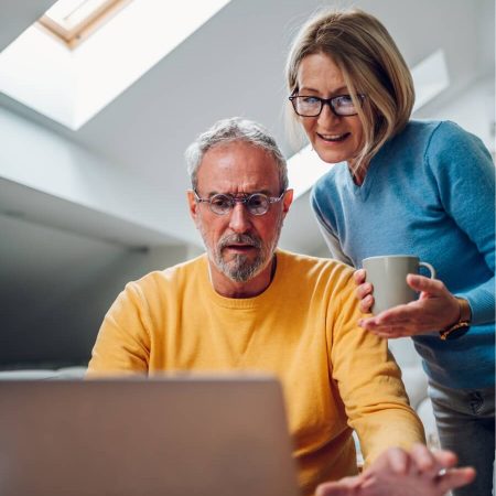 A couple work through their finances on the lap top as they consider how much of a better idea it would be to work with an accountant.